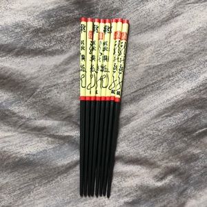 Set of 8 chopsticks, never used.